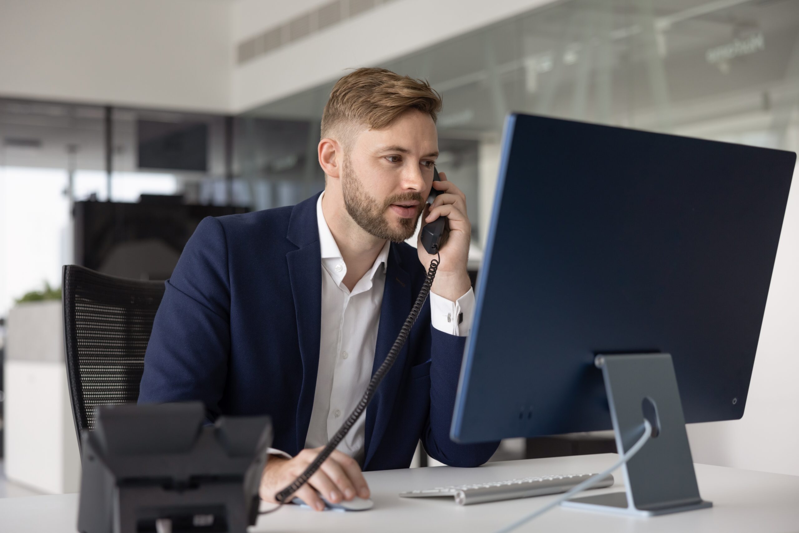 Business professional using VoIP phone services